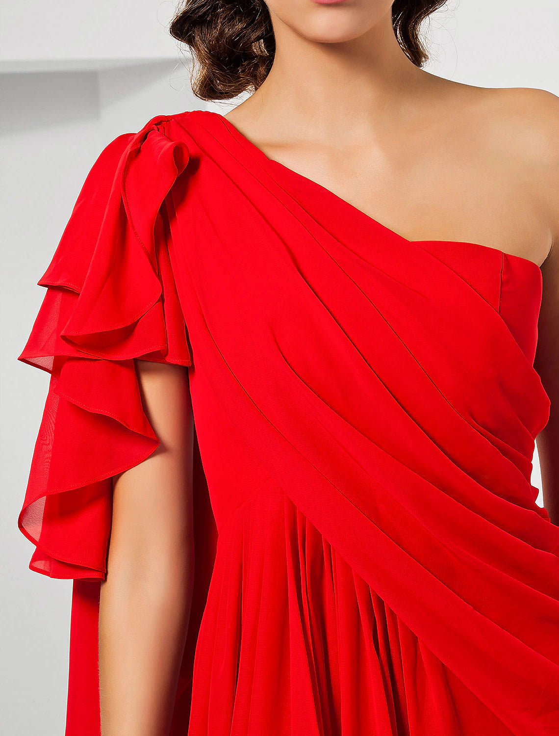 Side view of the blue chiffon dress, highlighting the slit and movement.