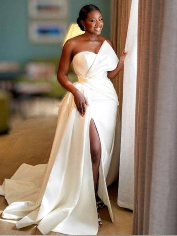 Elegant sheath column satin wedding dress with ruched sweetheart neckline and sweep train.