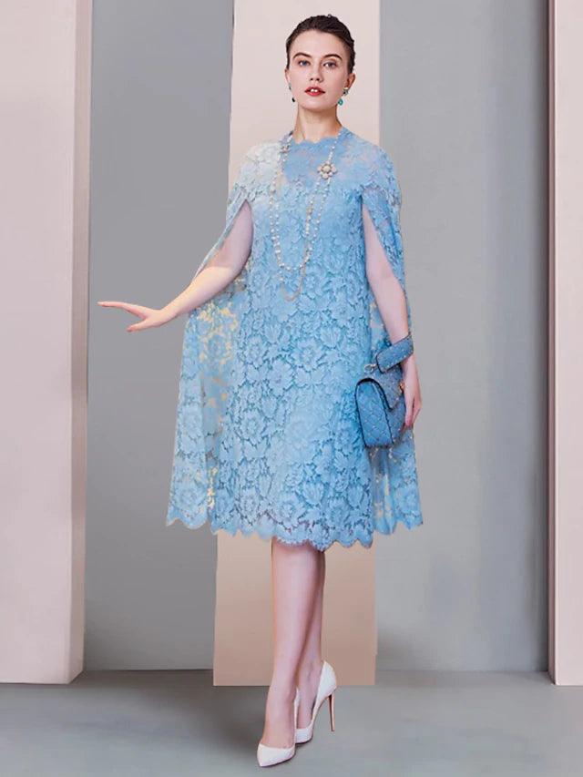 Woman wearing an elegant lace sheath column mini dress with a scoop neck.