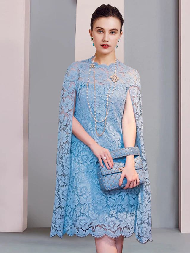 Side view of a woman in a lace sheath column mini dress.