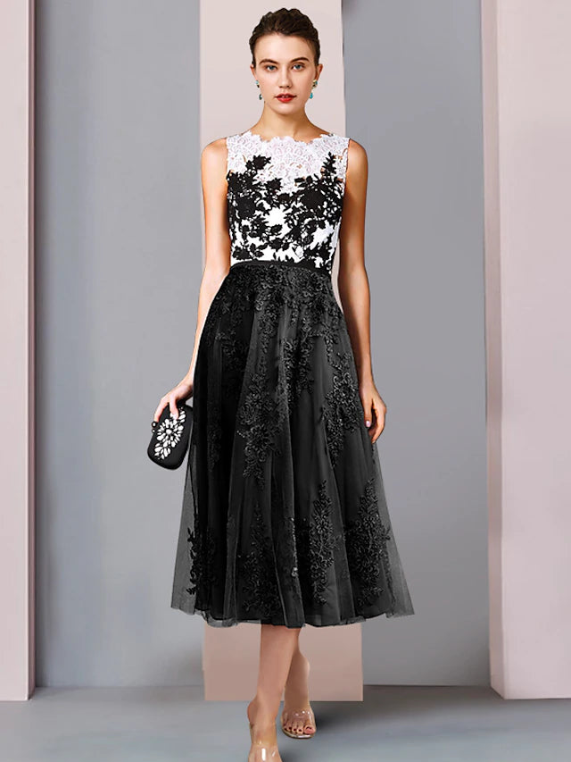 Elegant blue sheath column dress with scoop neck and tea length.
