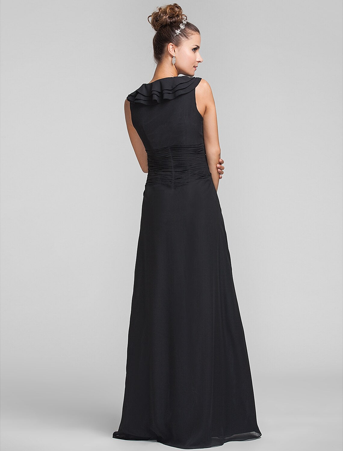 Woman wearing a floor-length sheath column bridesmaid dress.