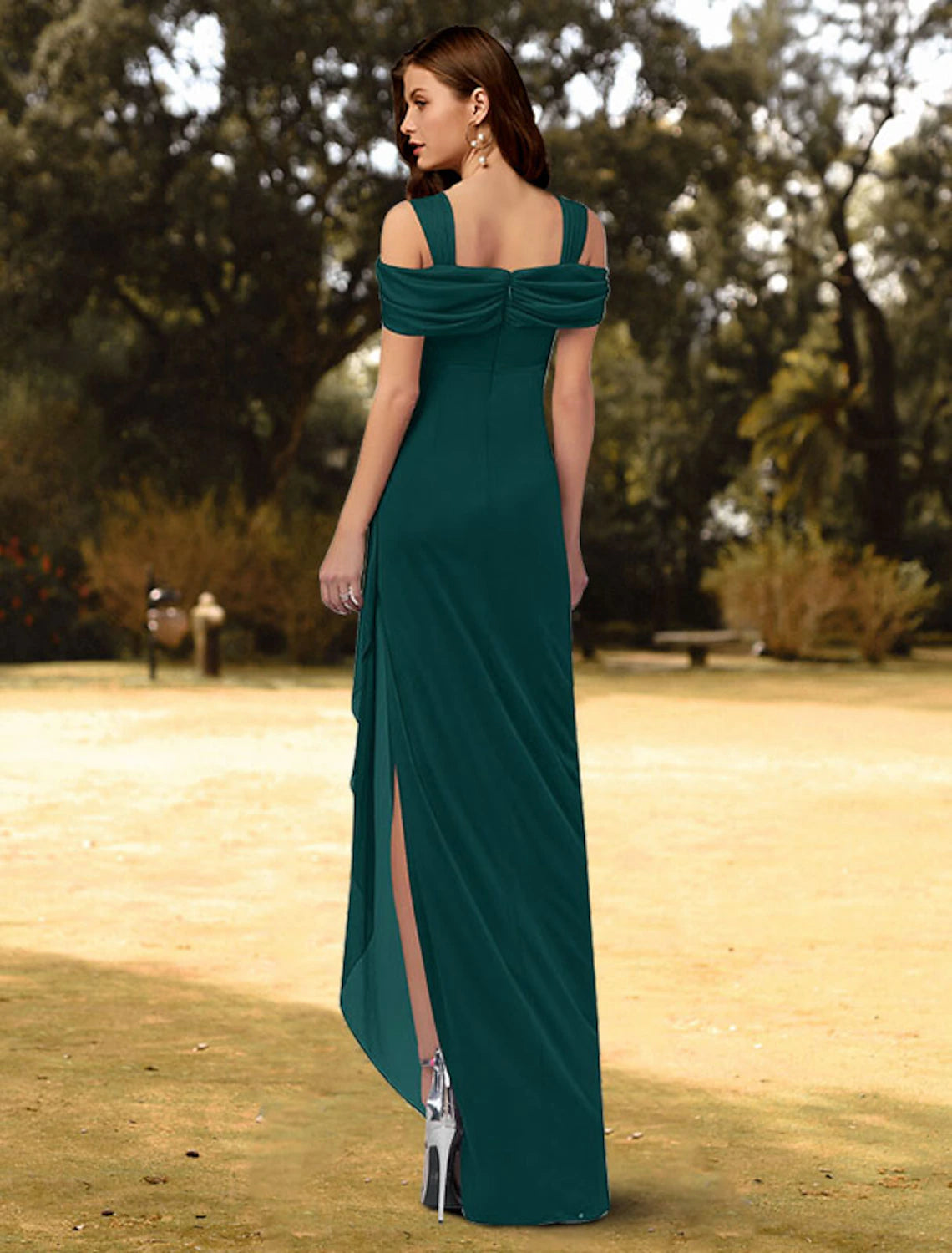 Chiffon evening dress with crystal embellishments and a side slit.