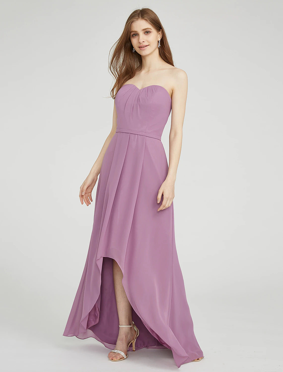 Detailed view of the asymmetrical hemline and chiffon fabric of a light blue bridesmaid dress.
