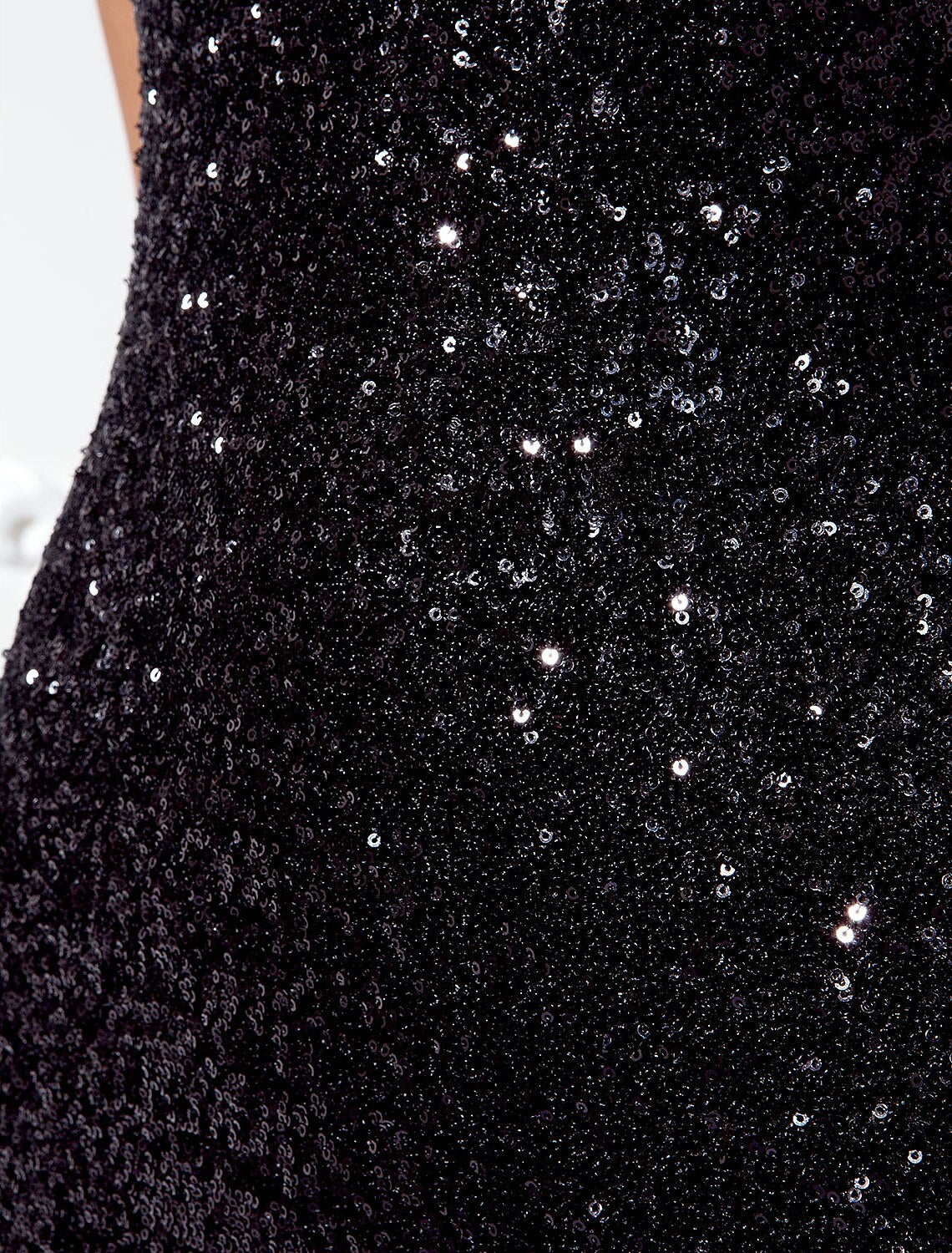 Close-up of the sequin detail on the elegant V-neck floor-length sheath dress.