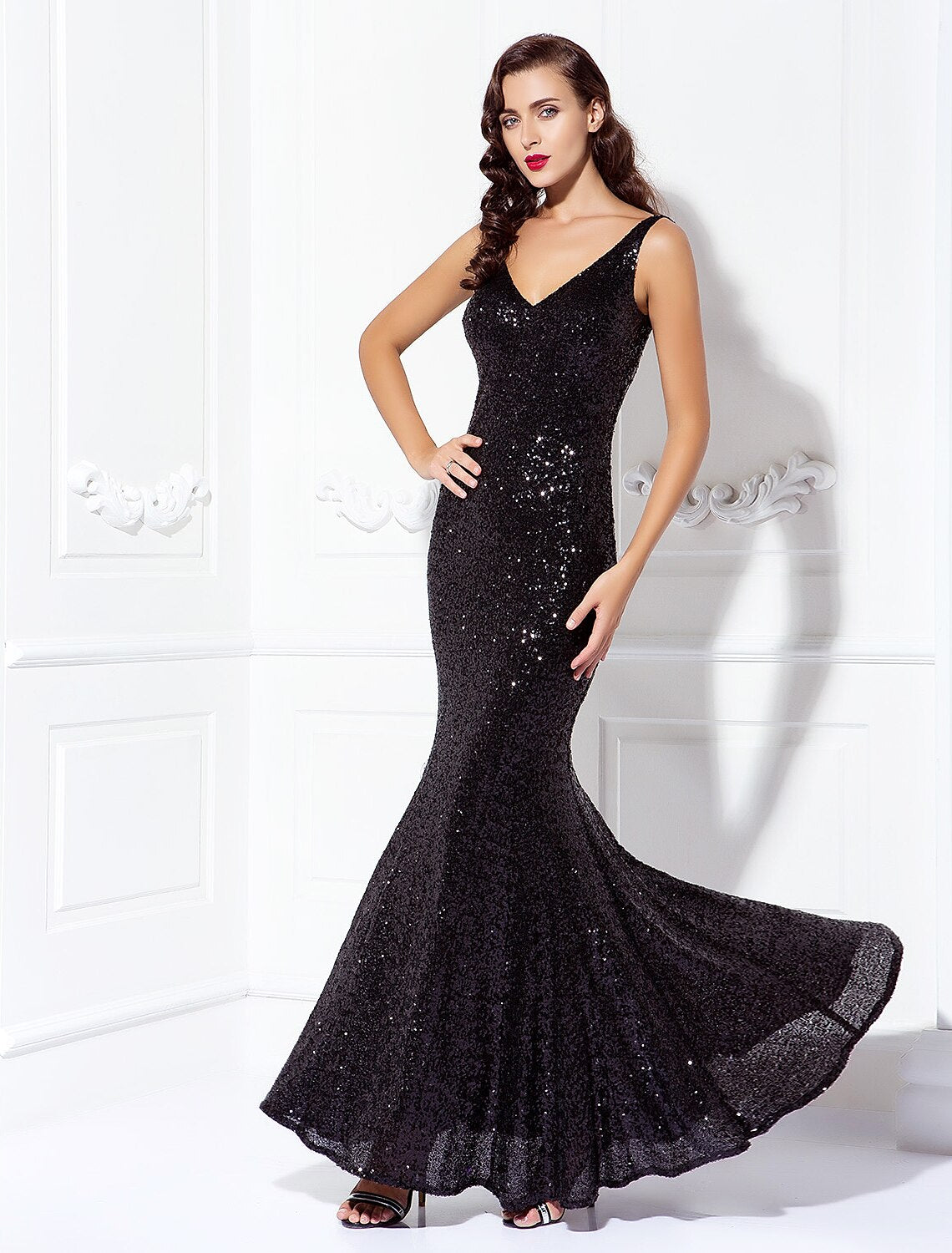 Full-length view of an elegant sequined V-neck floor-length sheath dress.