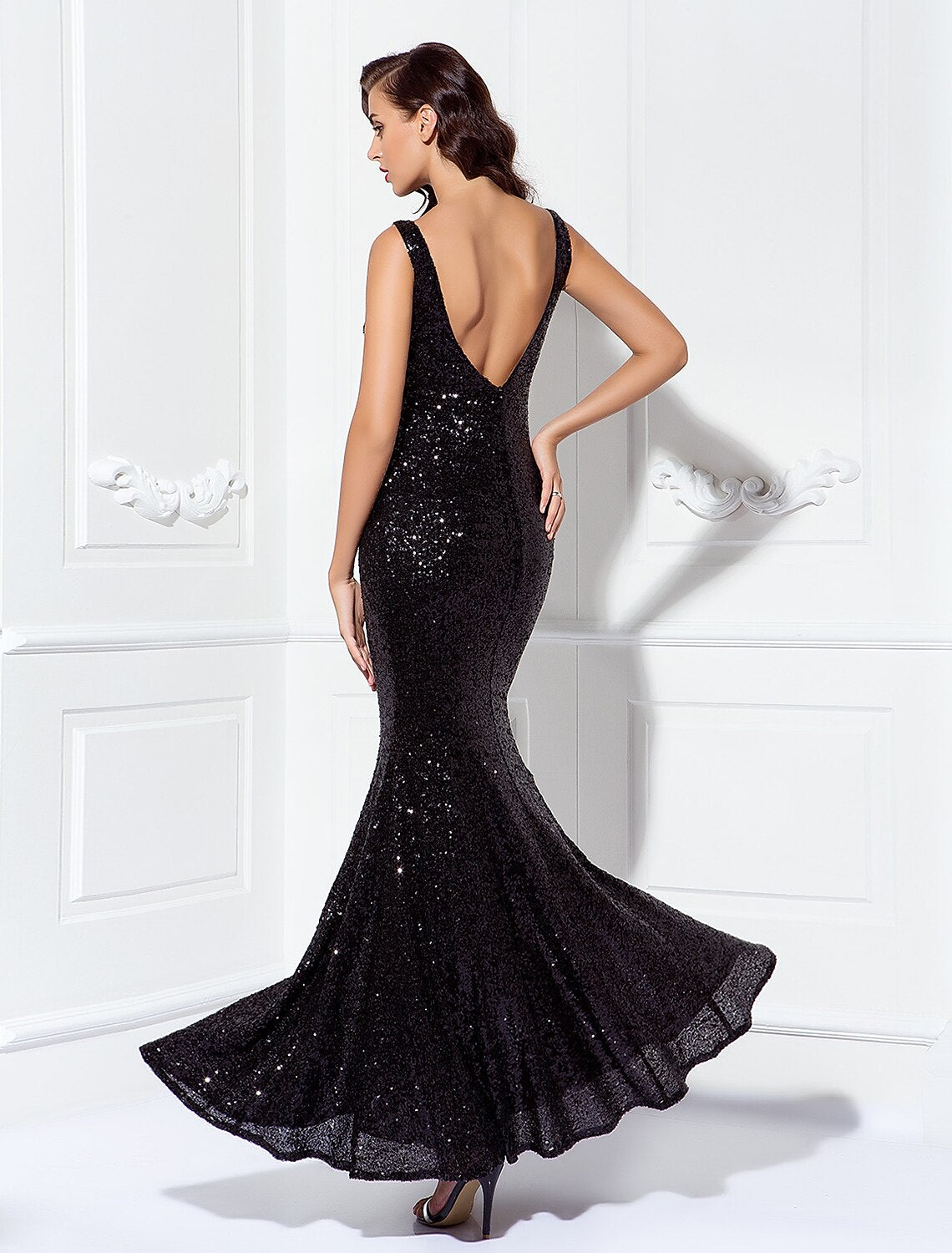 Detail shot of the elegant sequined V-neck floor-length sheath dress.