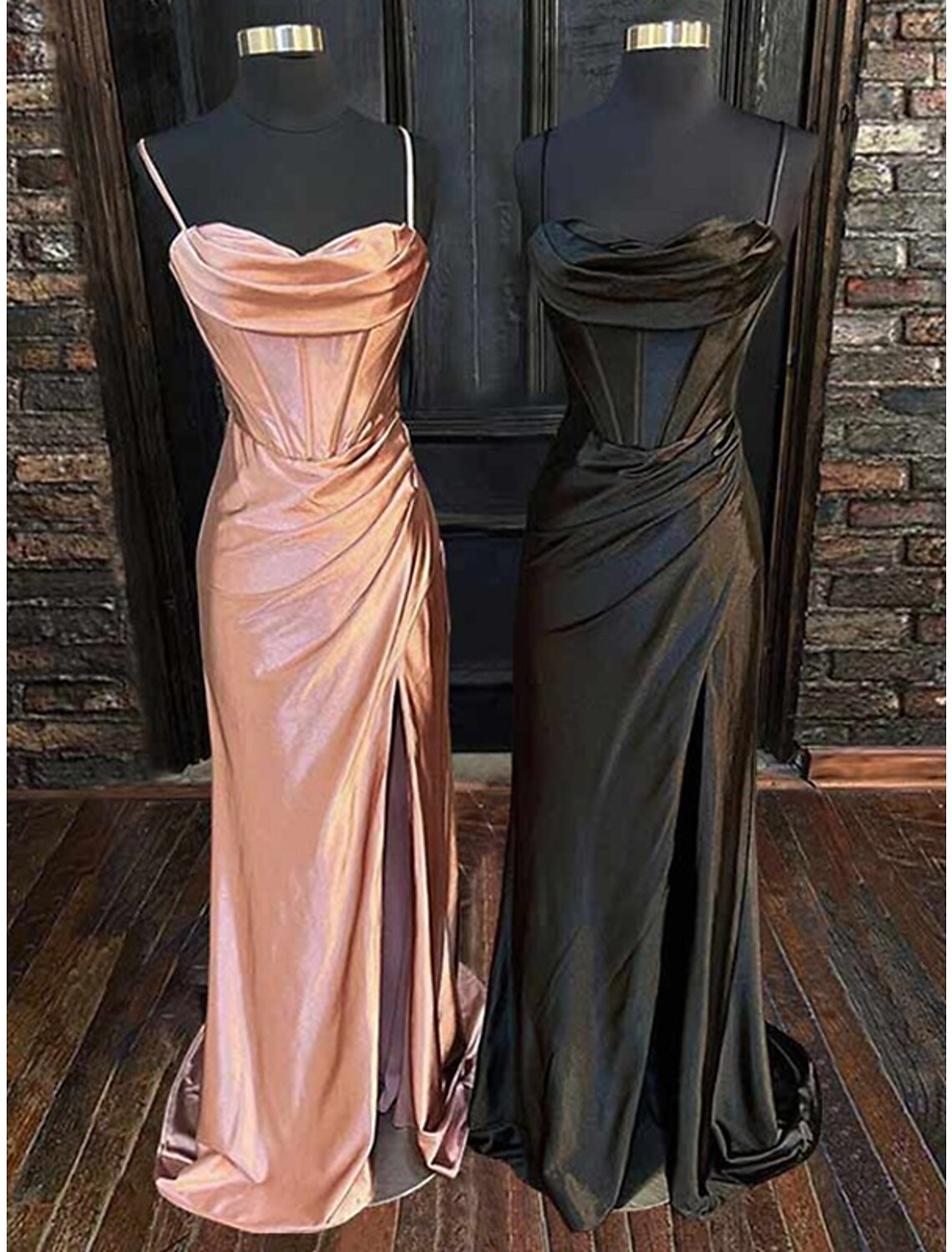 Rear view of a black satin formal dress, showcasing the criss-cross ruched back and floor-length silhouette.