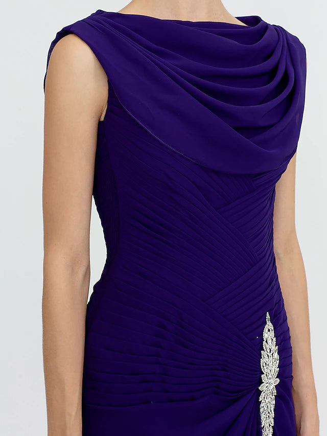 Close-up of the cowl neck and beaded detail on a formal dress.