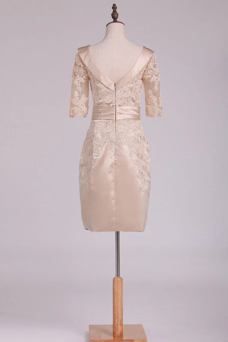 Side view of satin applique sheath dress.
