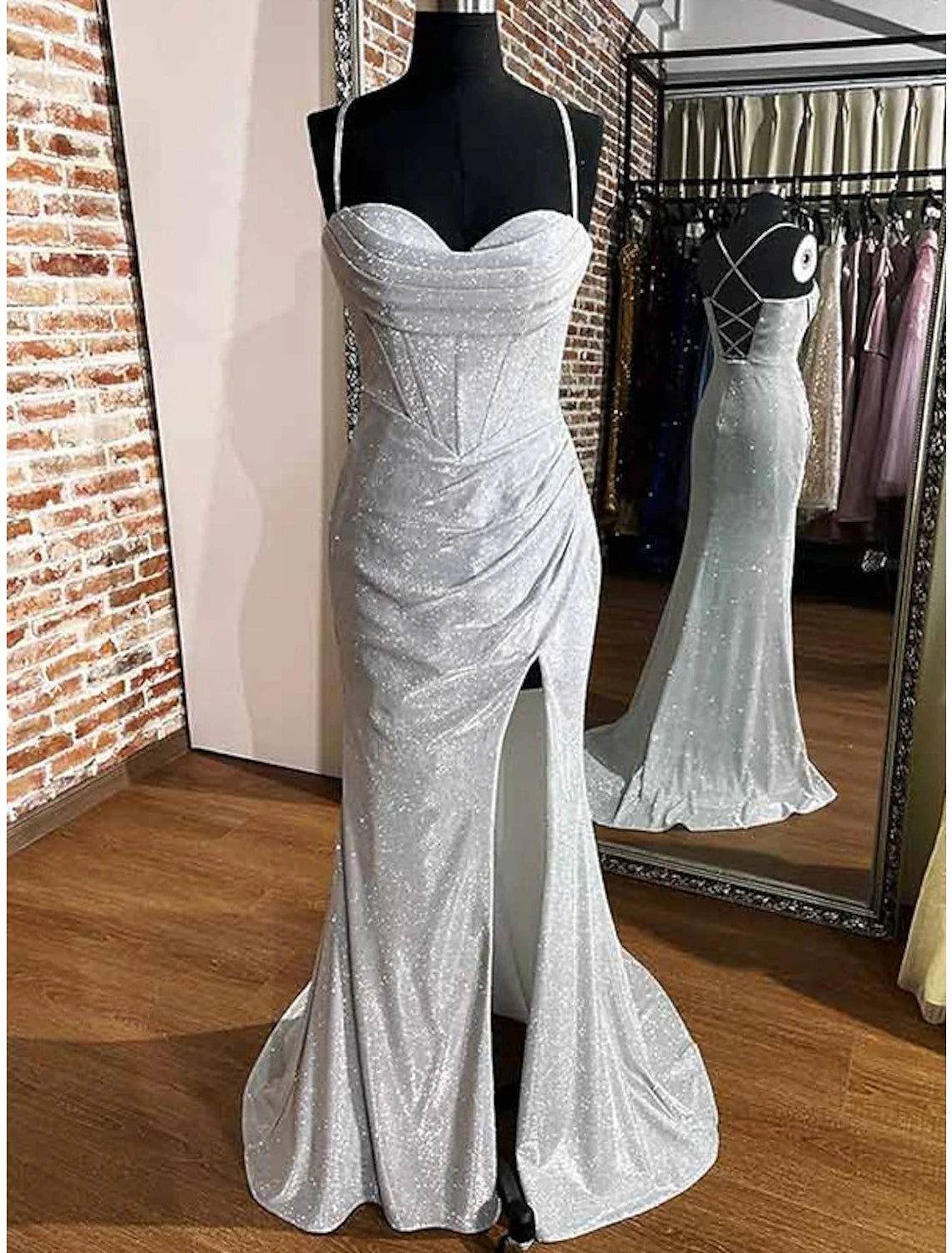 Elegant sequined sheath dress with cowl neck and high slit, front view.