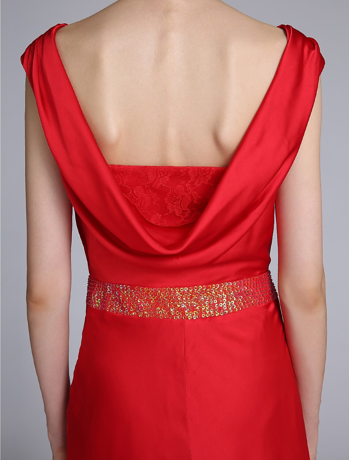 Rear view of the Mother of the Bride dress highlighting the open back design.