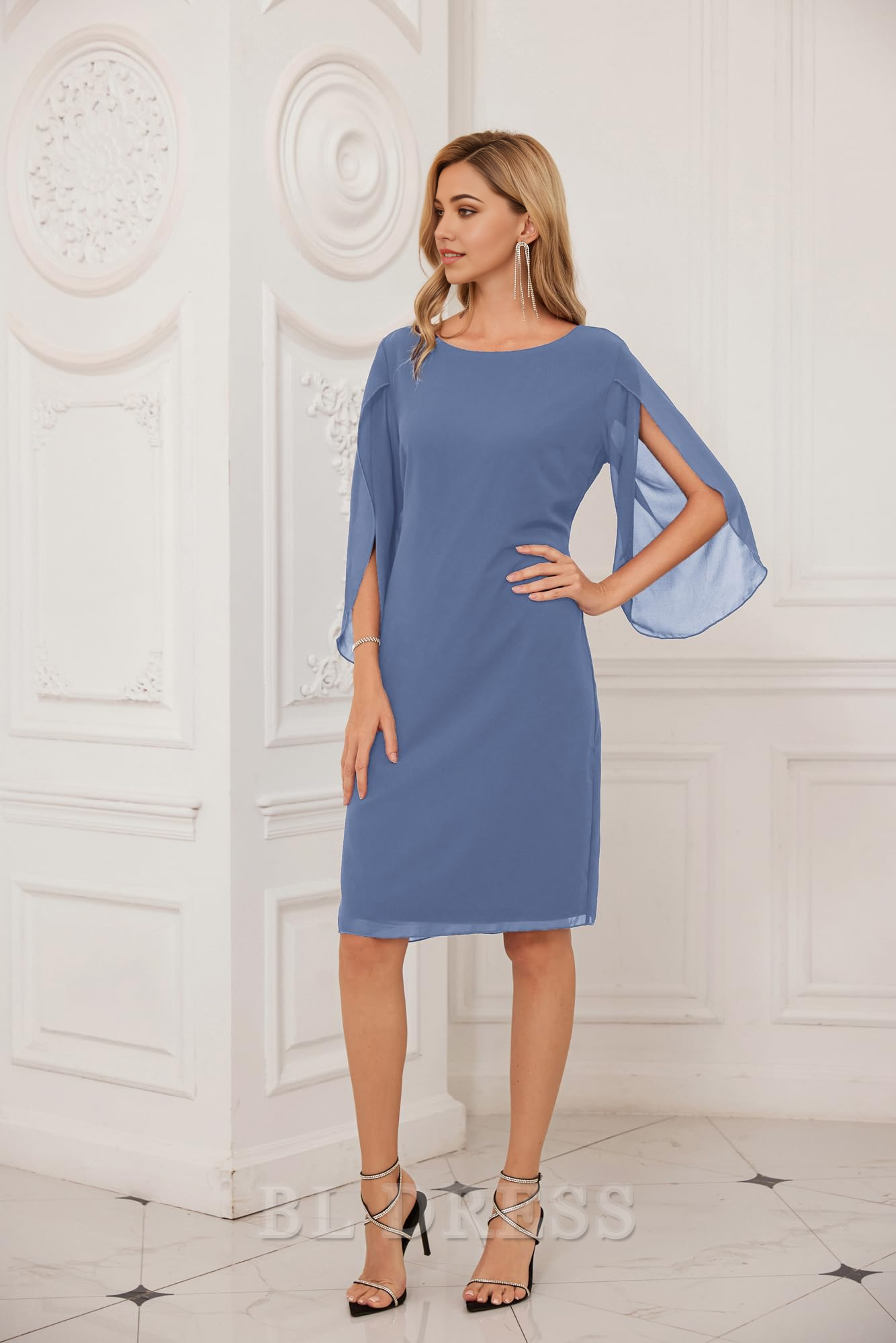 Close-up of the crew neck and flowing chiffon fabric of the light blue dress.