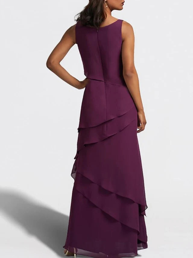Side view of a sophisticated sheath floor length wedding guest gown.