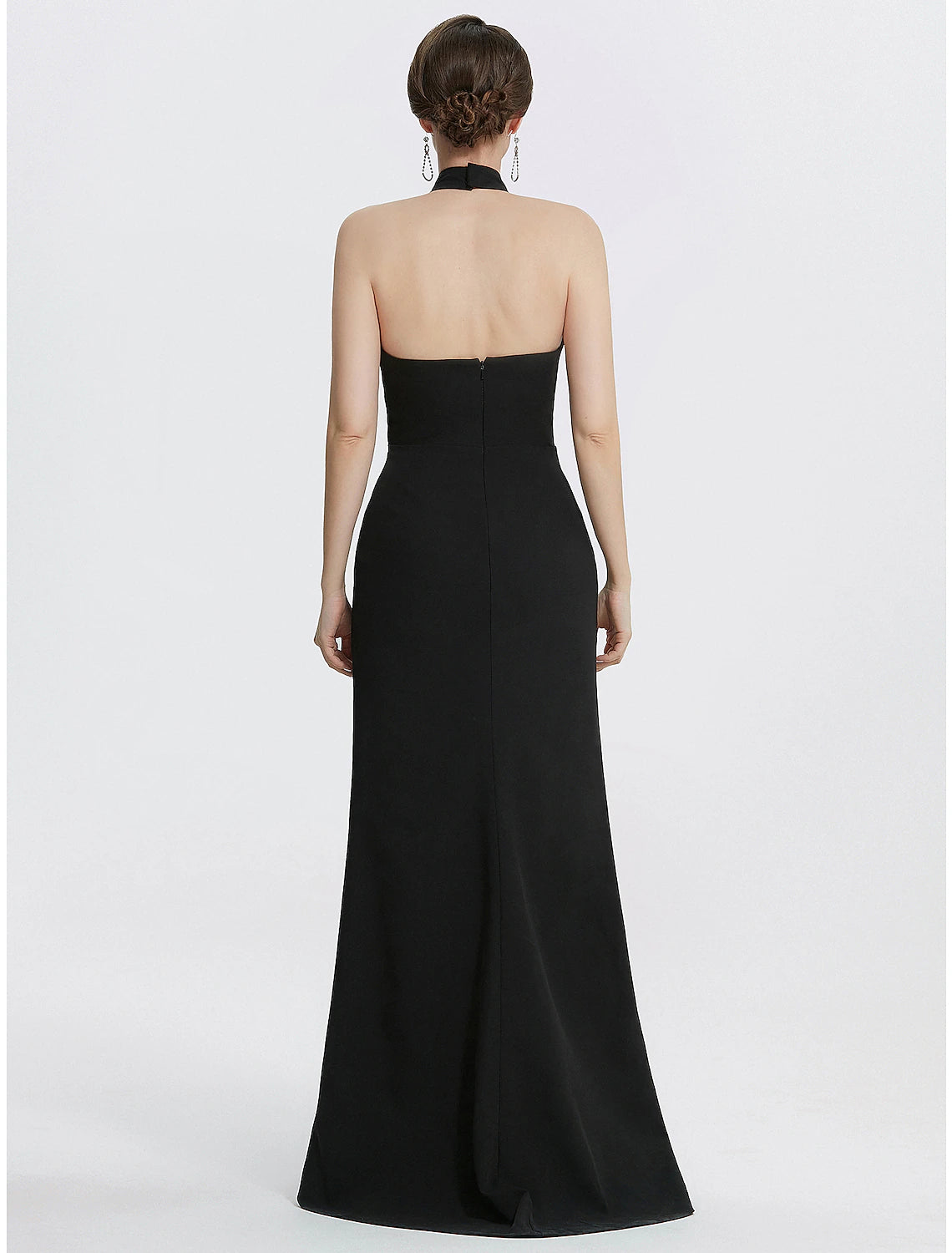 Side profile of the black halter neck formal dress.