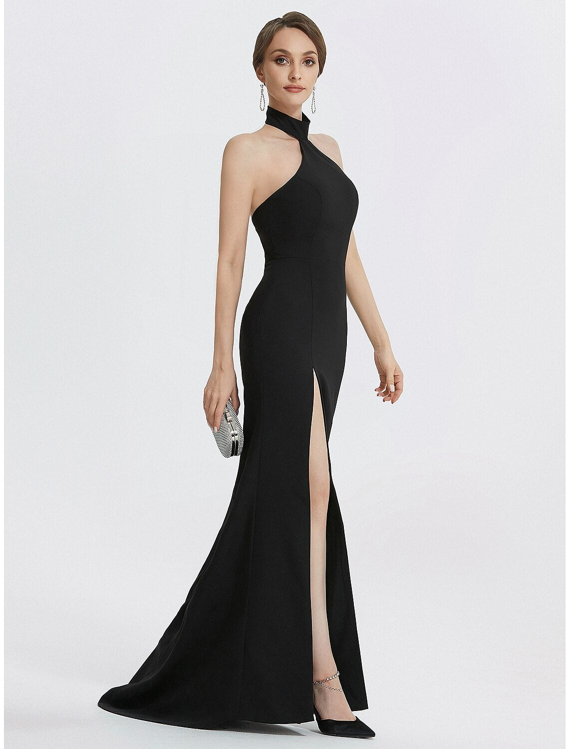 Detail of the ruched waist and stretch material of the black dress.