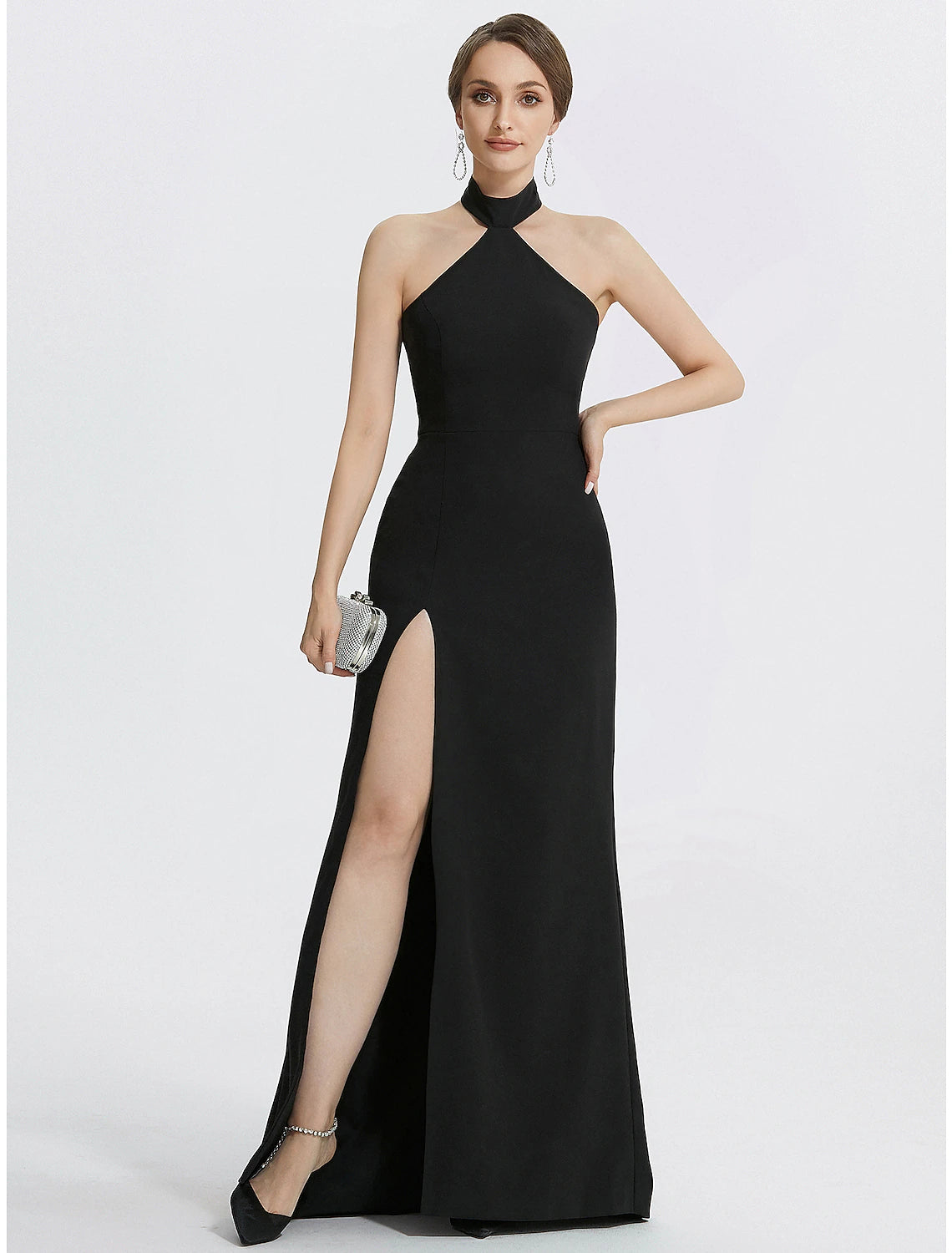 Elegant pose in the black halter neck formal dress.