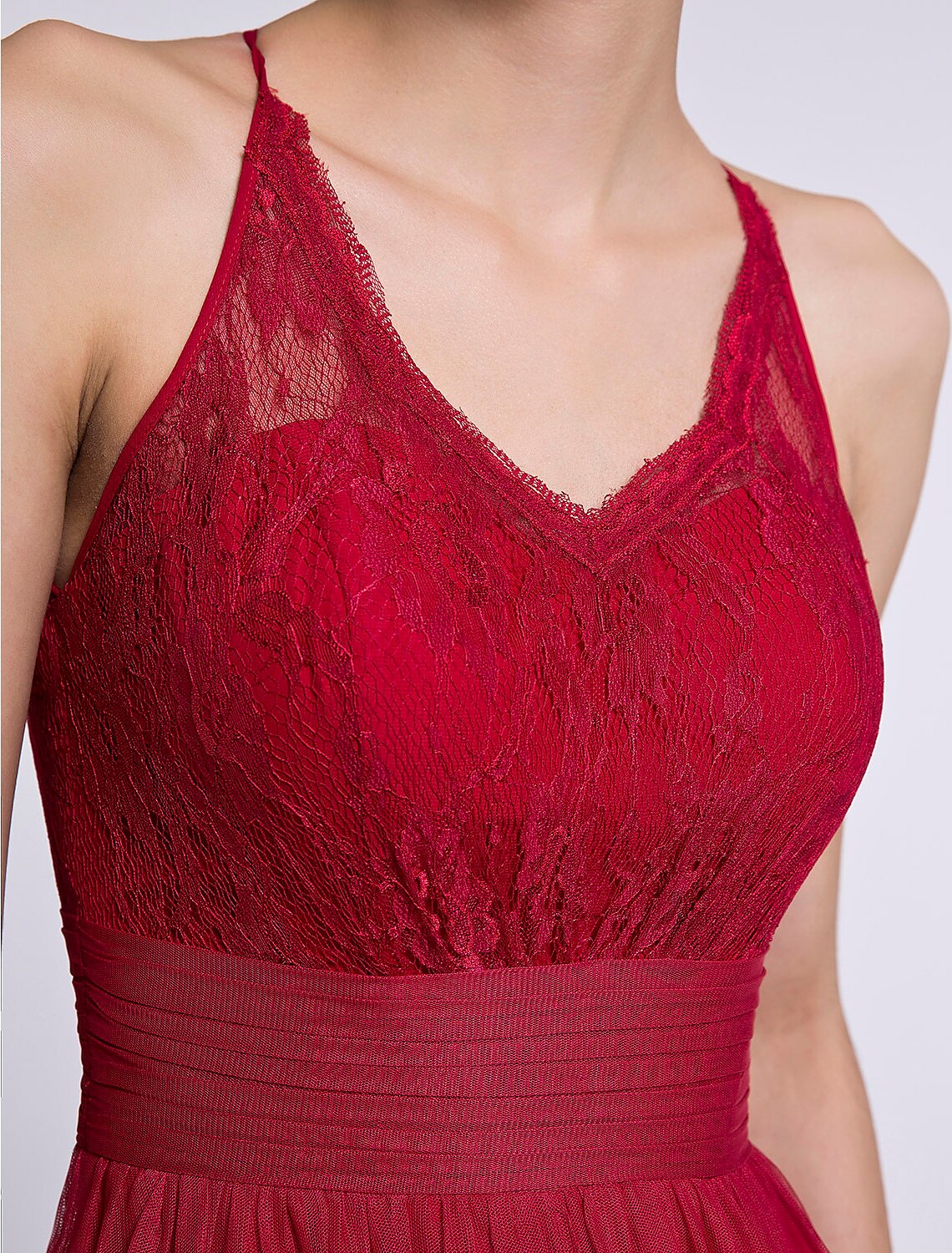 Close-up of the delicate lace and tulle fabric on the bridesmaid dress.