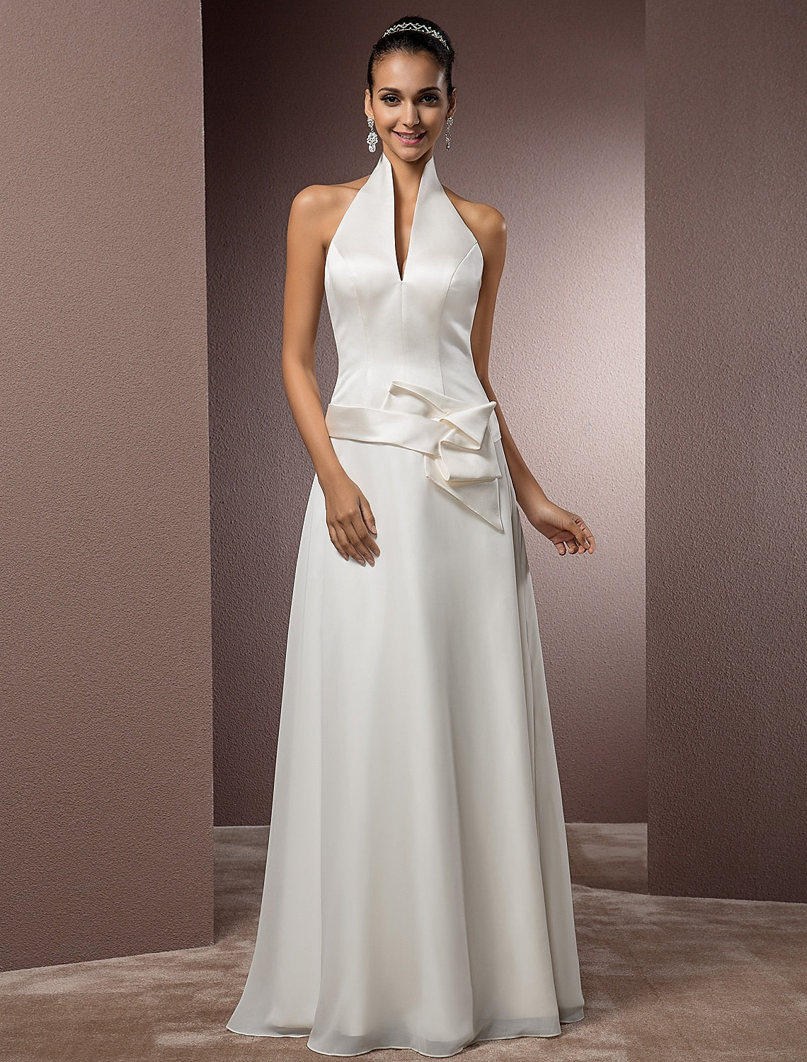 Elegant sheath wedding dress with halter neckline and sash.