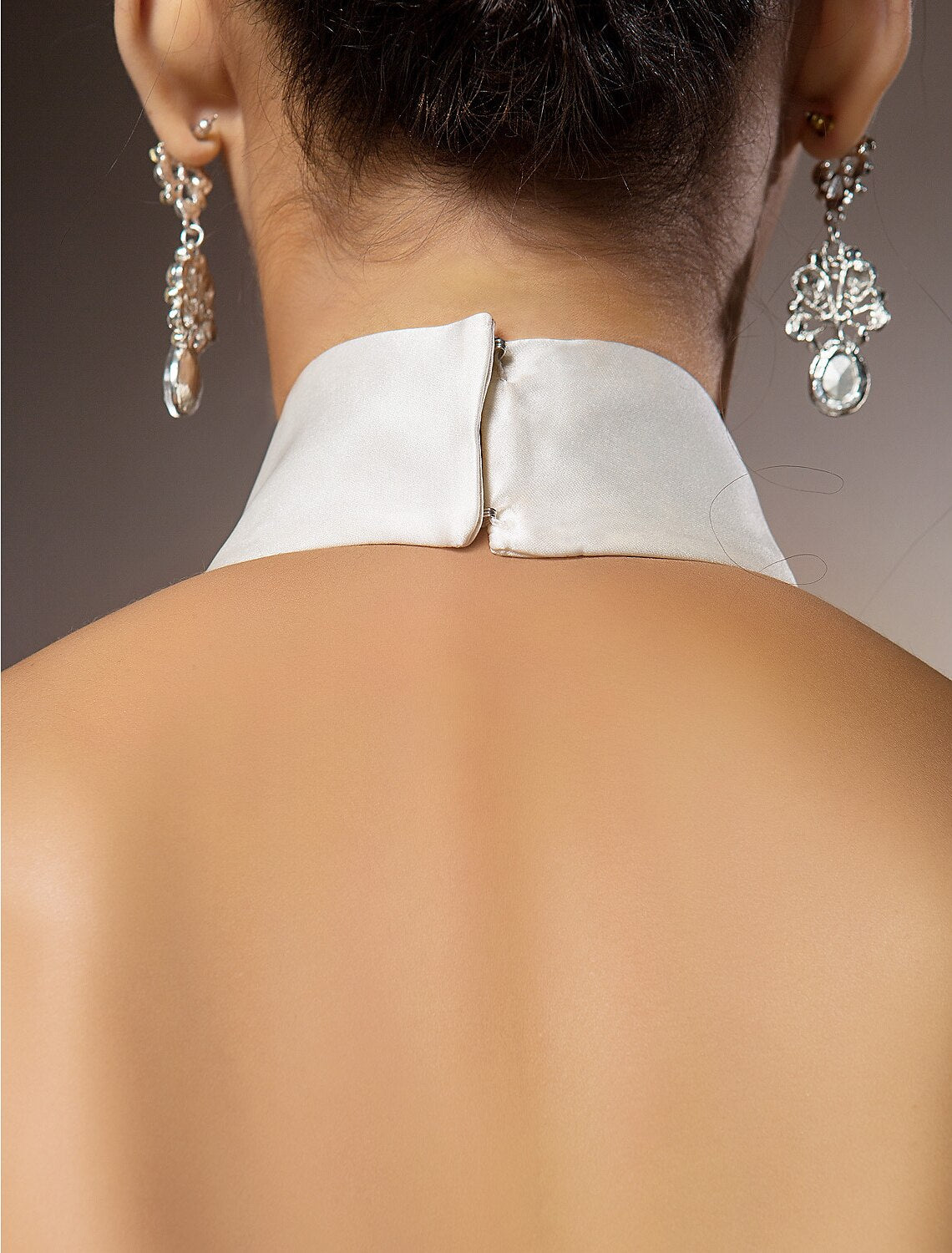Side view of floor-length bridal dress.