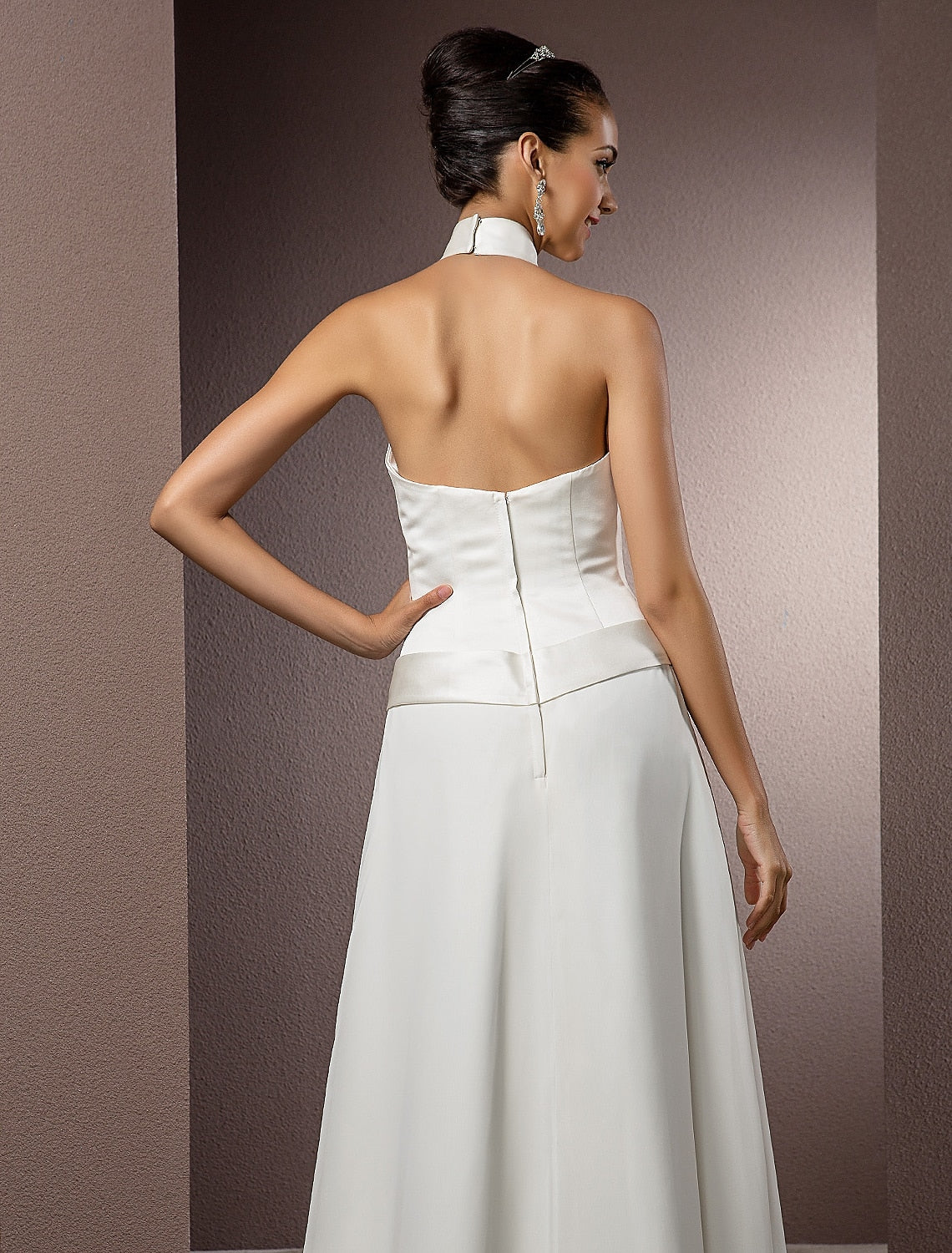 Full view of a satin bridal dress with a column silhouette.