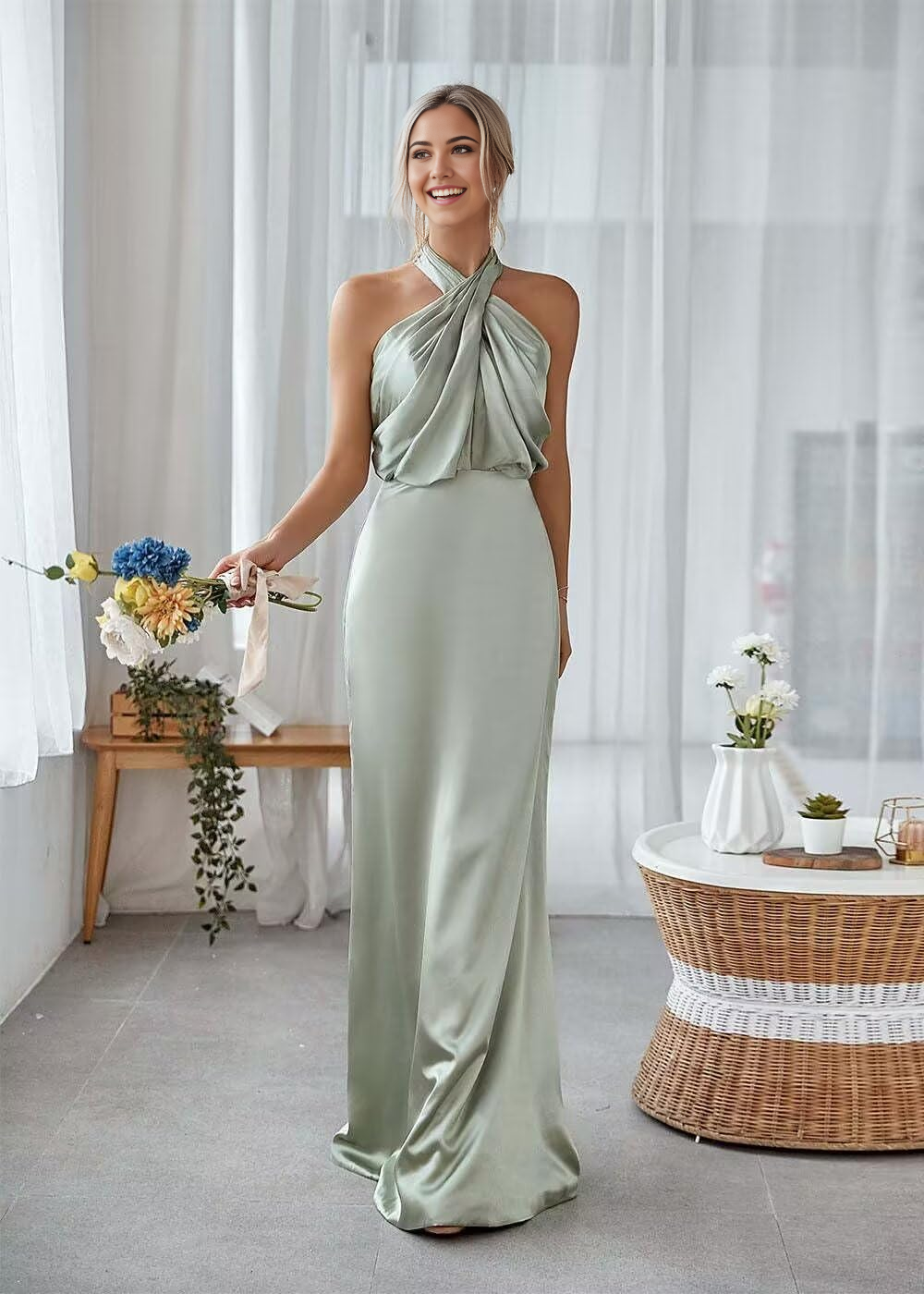 Woman wearing an elegant sheath halterneck satin pleated floor-length formal dress.