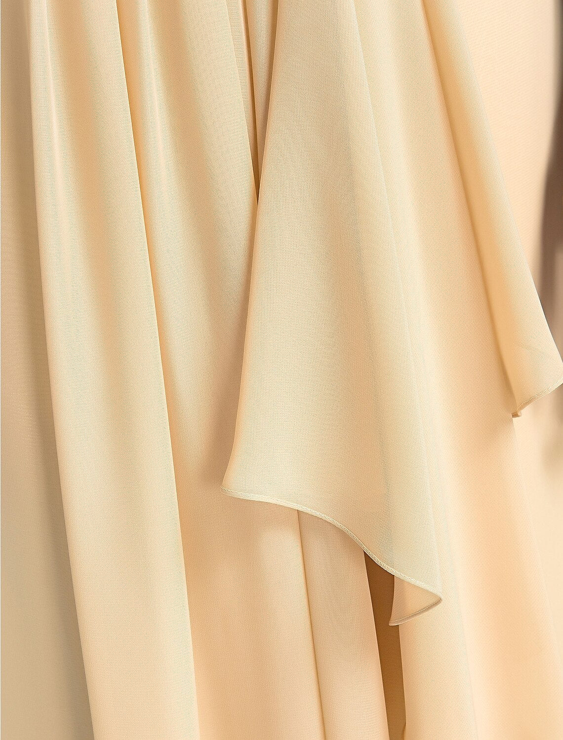 Close-up of the draped detail on a high neck chiffon bridesmaid gown.