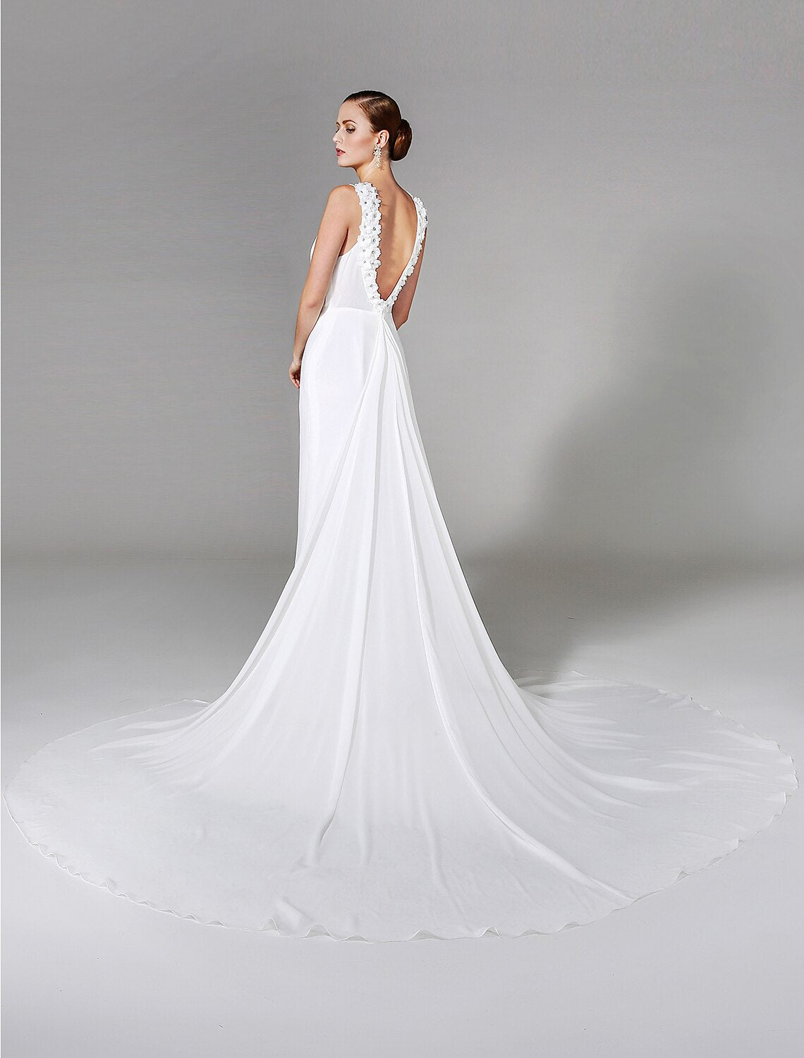 Back view of sheath bridal gown with chapel train.