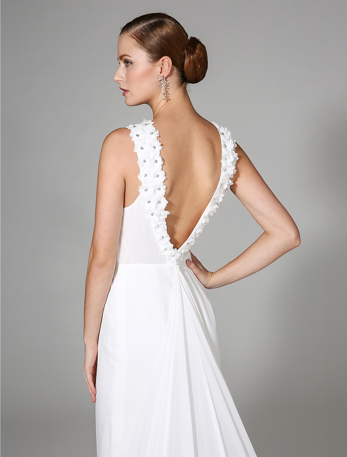 Close-up of intricate beading on the wedding dress.