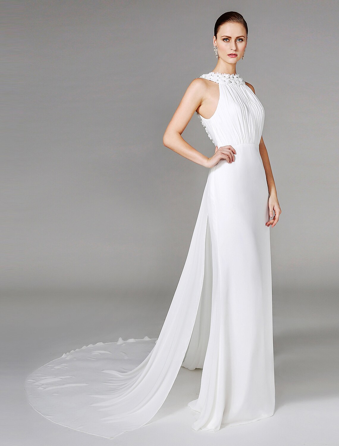 Bridal gown with chapel train and delicate beading.