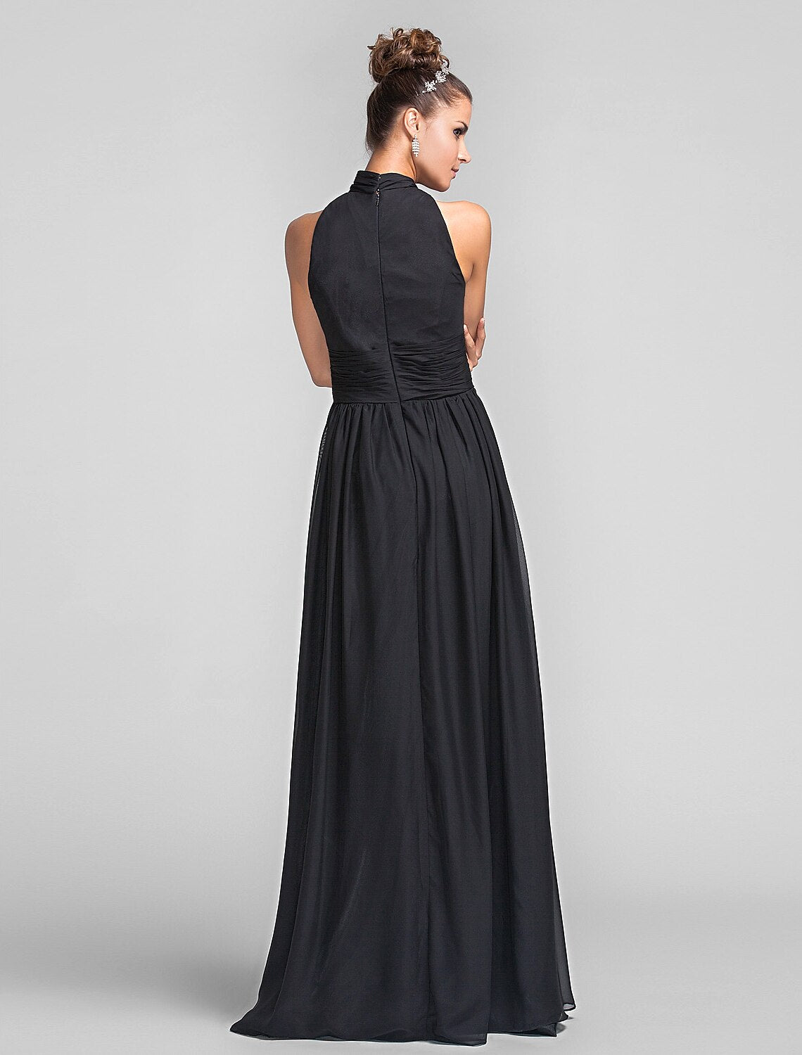 Back view of a floor-length chiffon bridesmaid dress with cascading ruffles.