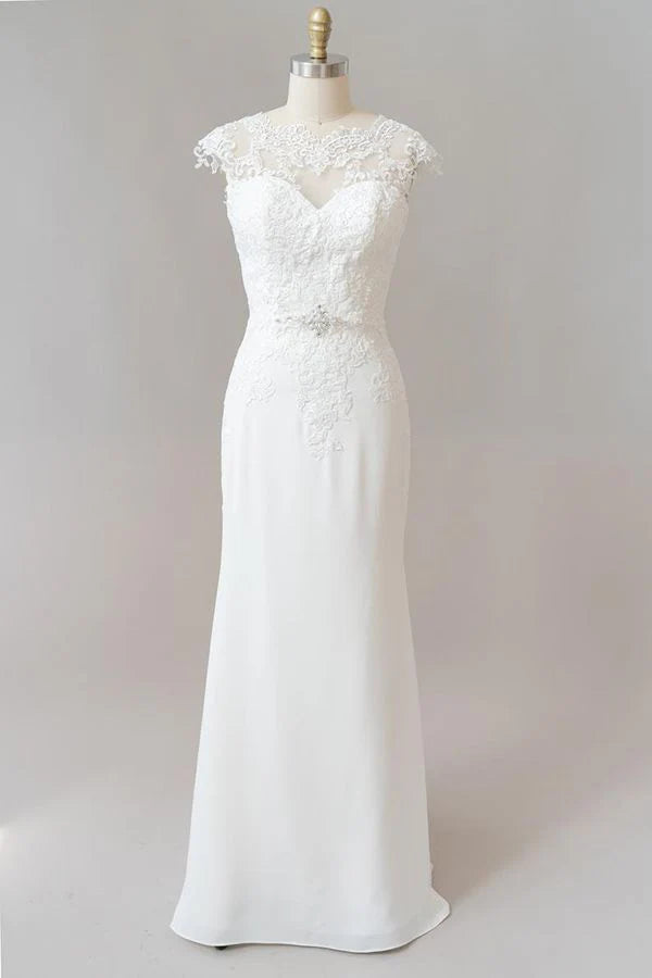 Elegant sheath wedding dress with illusion lace and cap sleeves.