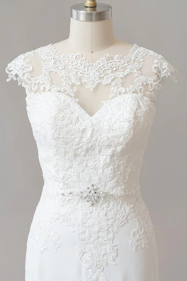 Close-up of illusion lace detail on a cap sleeve wedding dress.