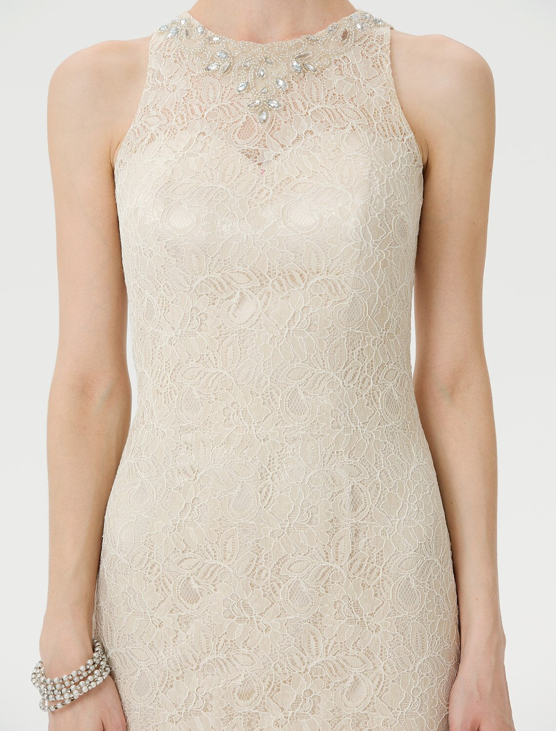 Mother of the Bride dress highlighting the sleek column silhouette.