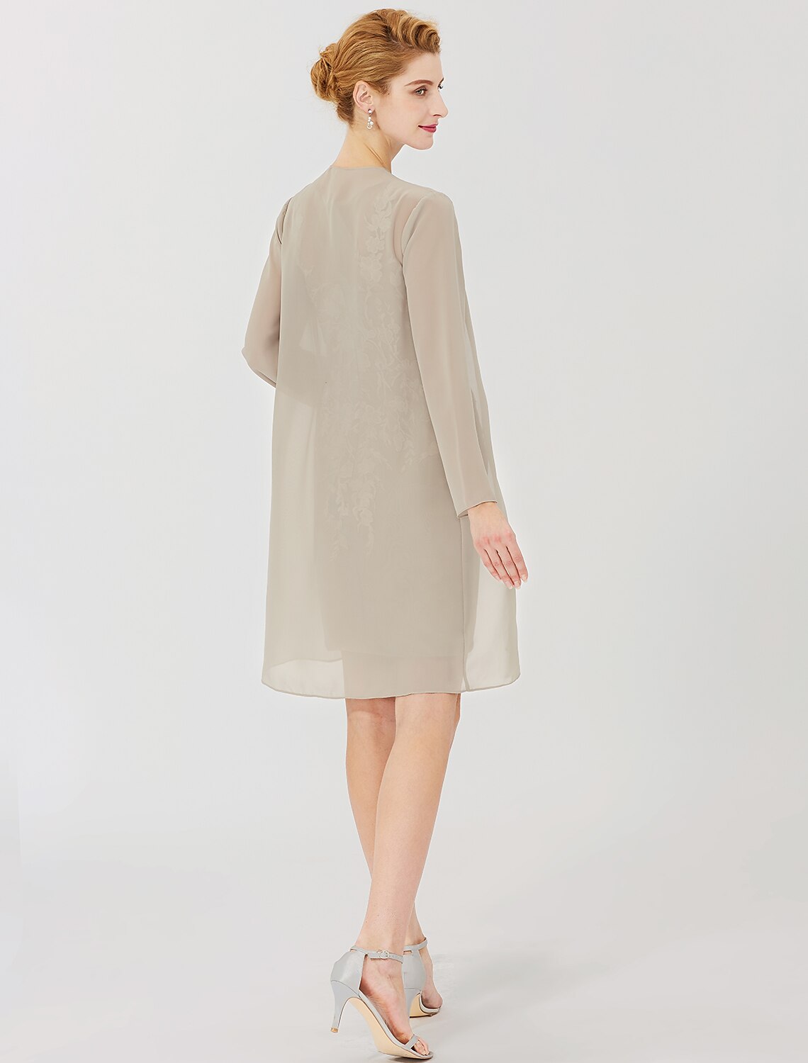 Back view of the formal knee-length lace dress.