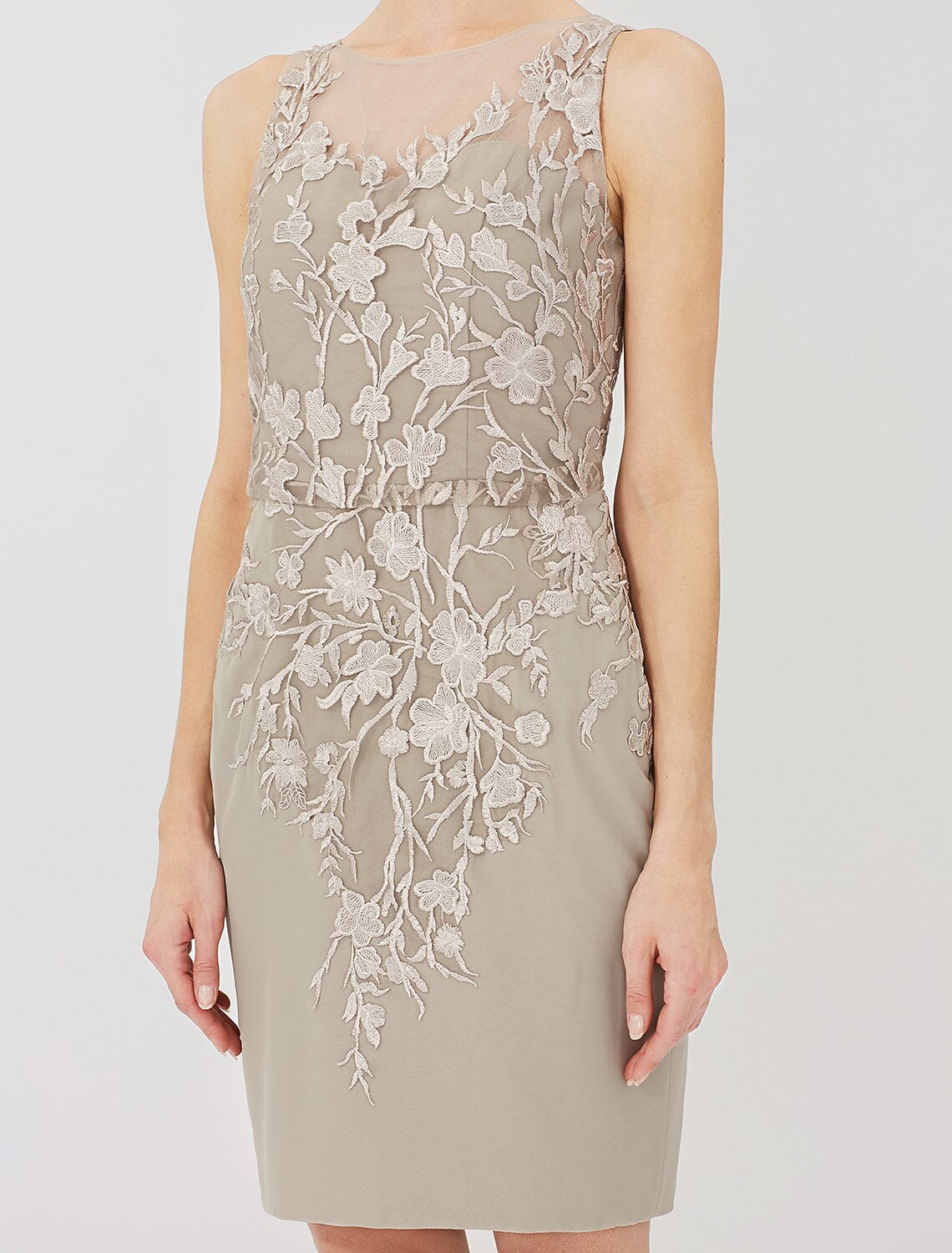Close-up of illusion neckline and lace appliques on the dress.
