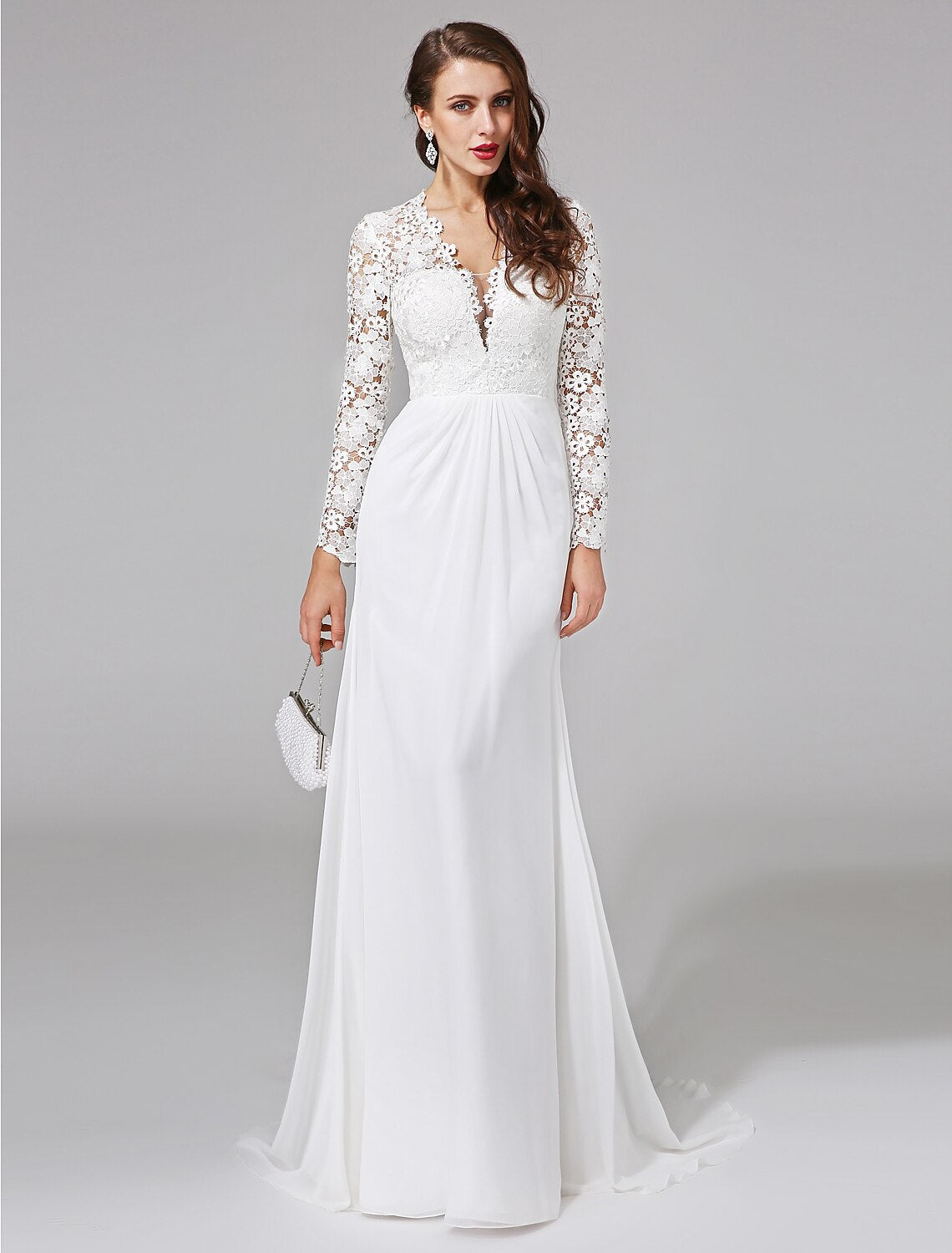 Close-up of the lace and illusion neckline on a wedding dress.