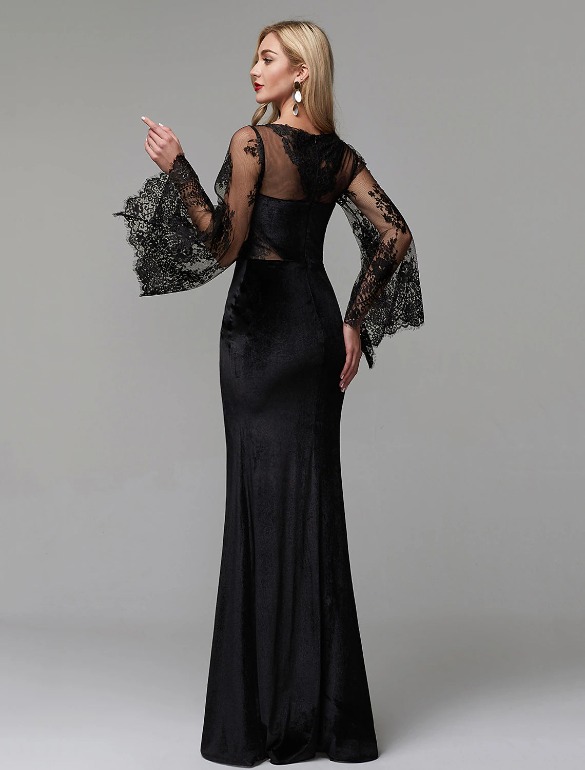 Front view of the sheath dress with lace details.