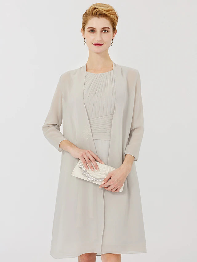 Side view of the sheath dress, highlighting its 3/4 sleeves and knee length.