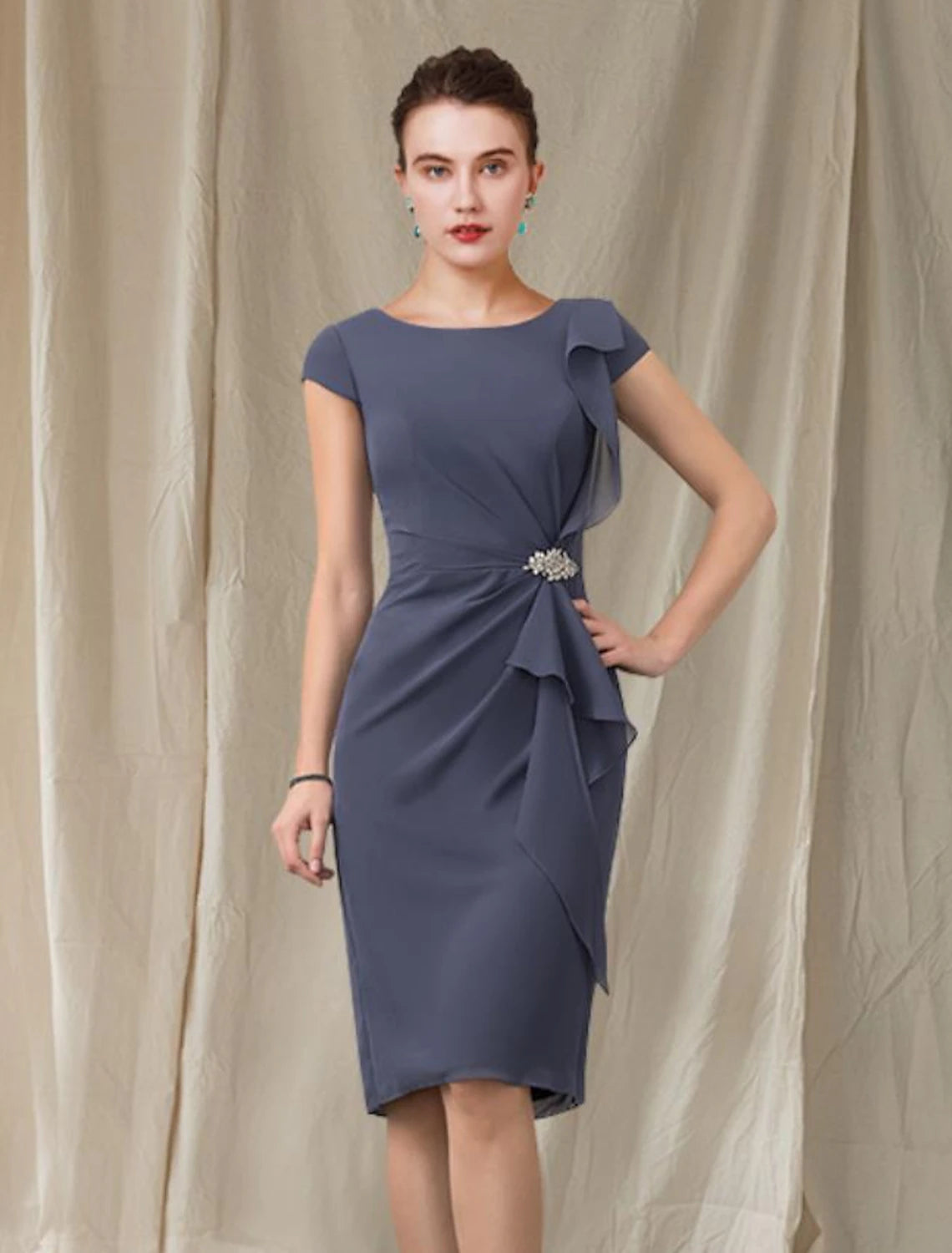 Back view of the elegant knee-length chiffon sheath dress, showing the silhouette.