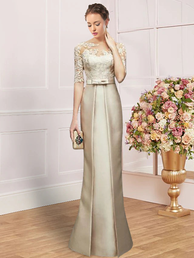 Elegant floor-length sheath dress with jewel neck and half sleeves, featuring ruching and bow detail.