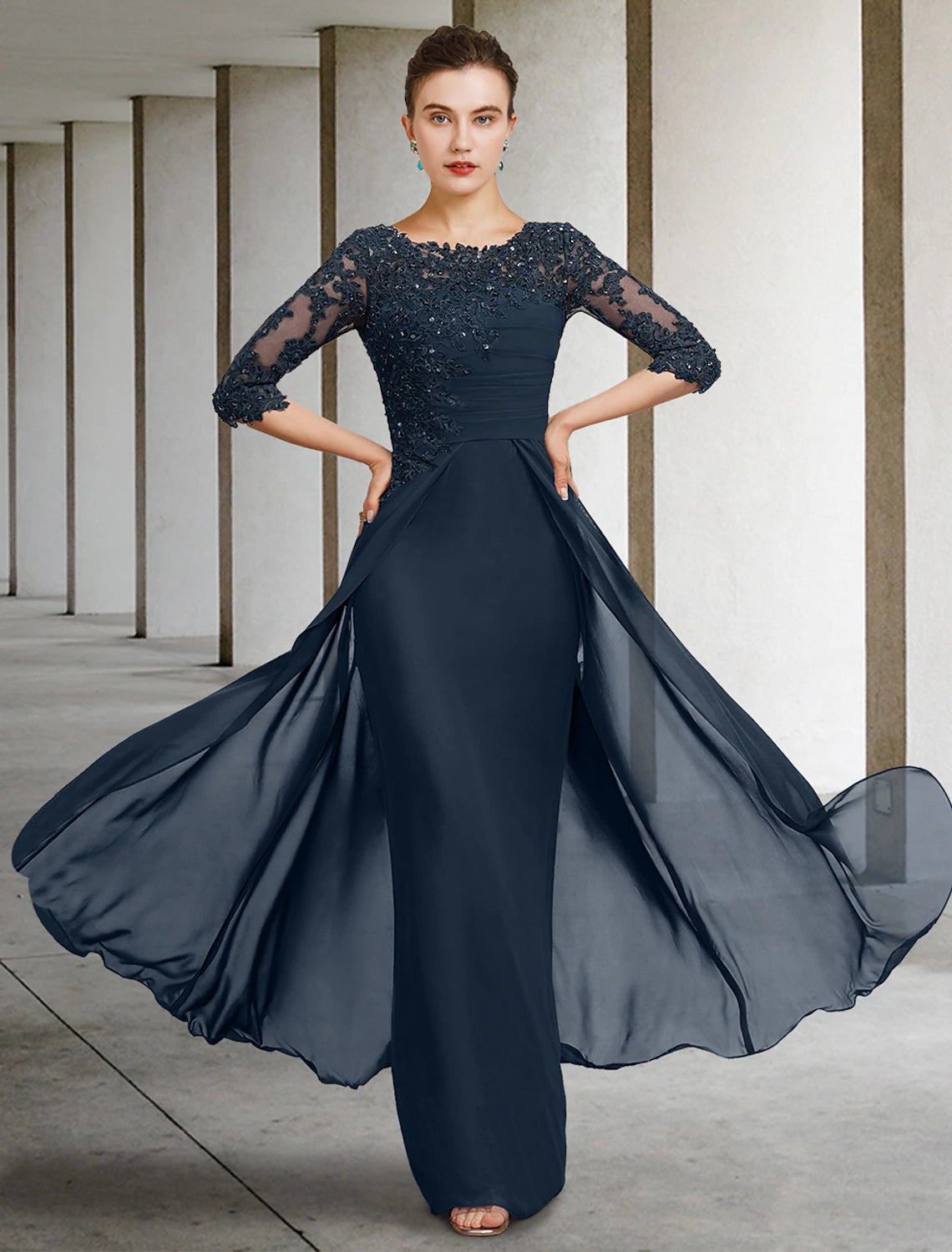 Elegant sheath mother of the bride dress with jewel neck and half sleeves.