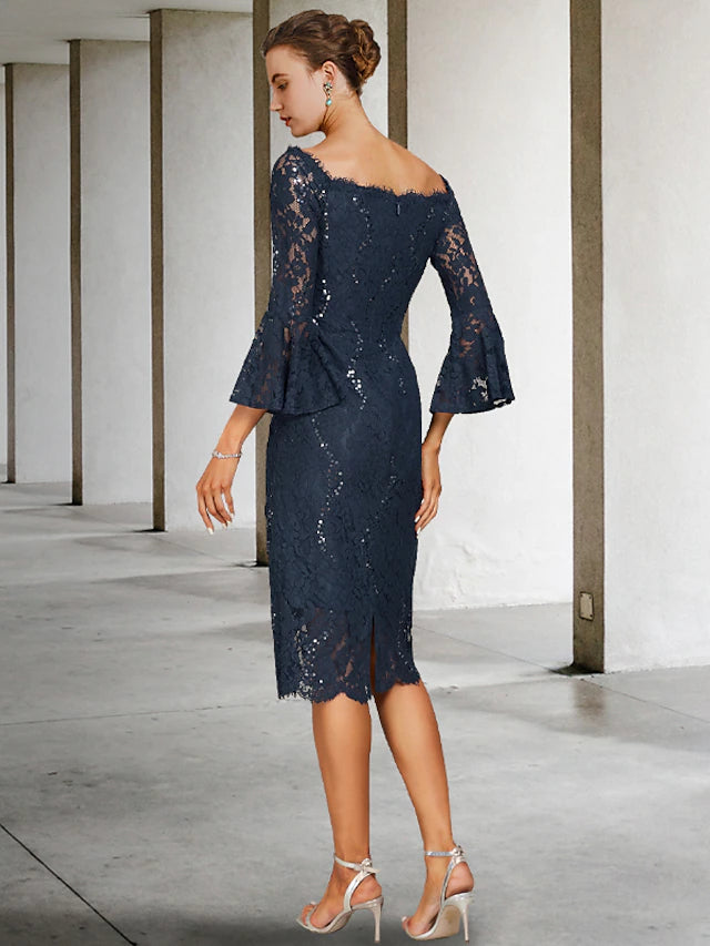 Side view of the vintage-inspired sheath dress, showcasing its elegant silhouette and flow.