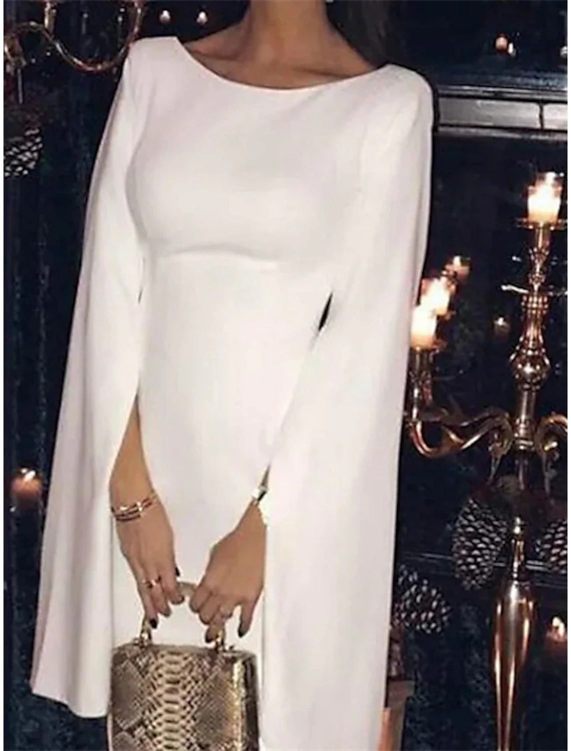 Side profile of the long sleeve satin dress for wedding guests.