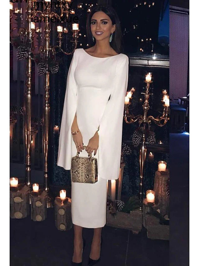 Woman wearing a sleek, dark long-sleeve jewel-neck tea-length sheath cocktail dress.