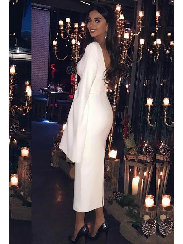 Back view of the dark sheath cocktail dress, highlighting the elegant backless design.