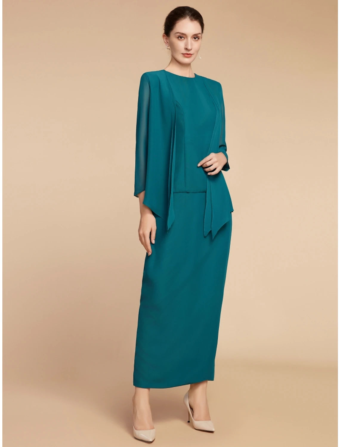 Elegant chiffon sheath dress with long sleeves and jewel neck.
