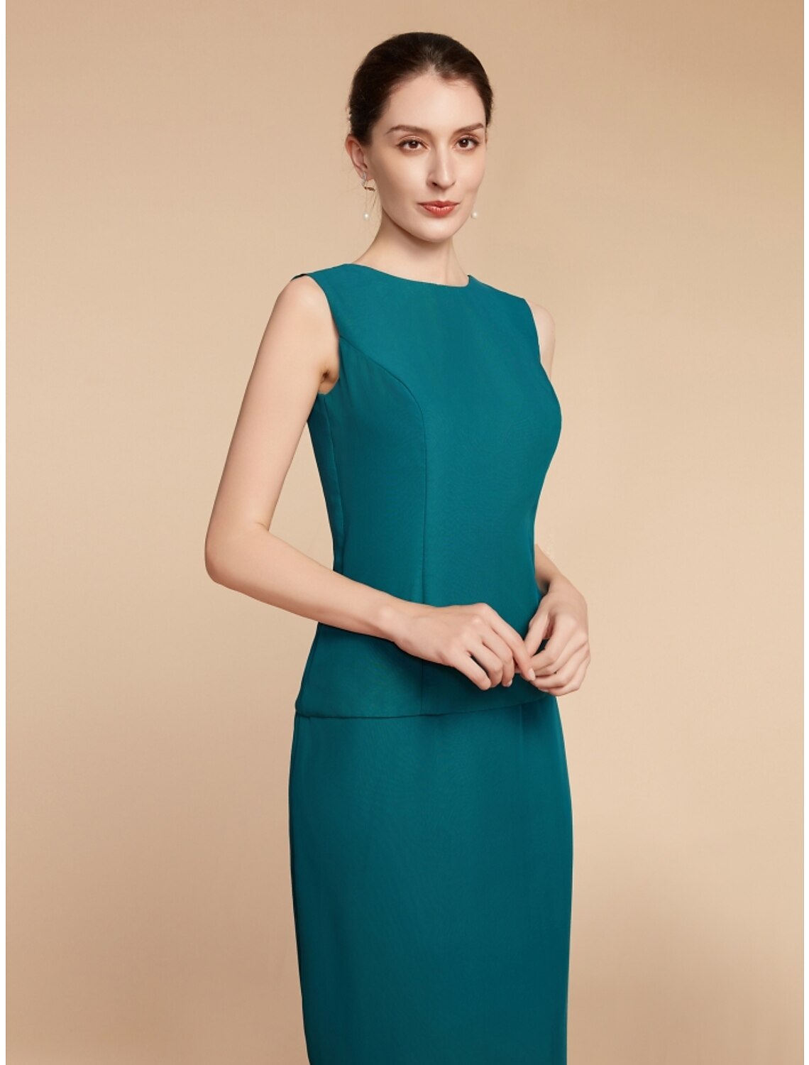 Back view of the sophisticated long sleeve formal gown.