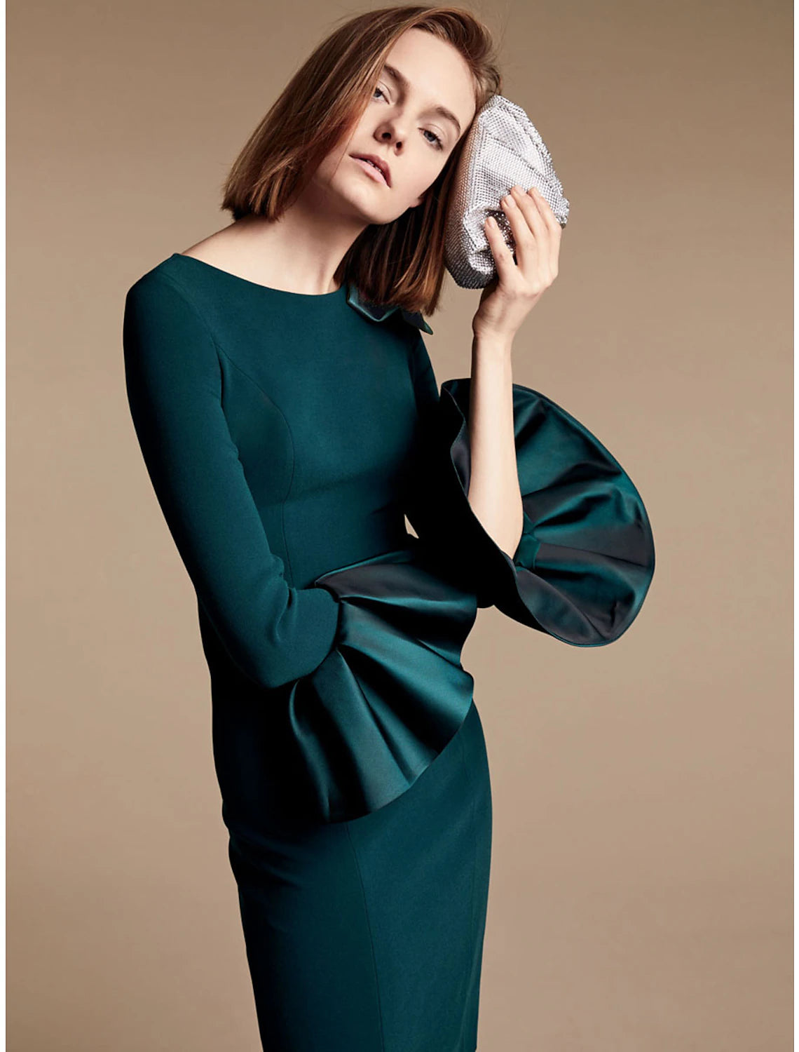 Elegant Sheath Mother of the Bride dress with jewel neck and long sleeves.