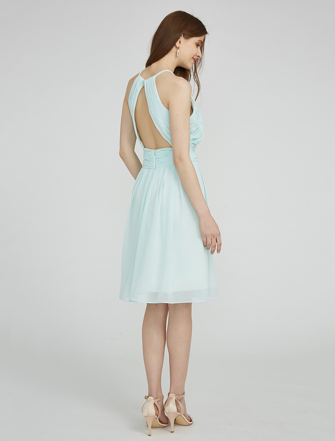 Close-up of the ruched chiffon fabric on the bridesmaid dress.